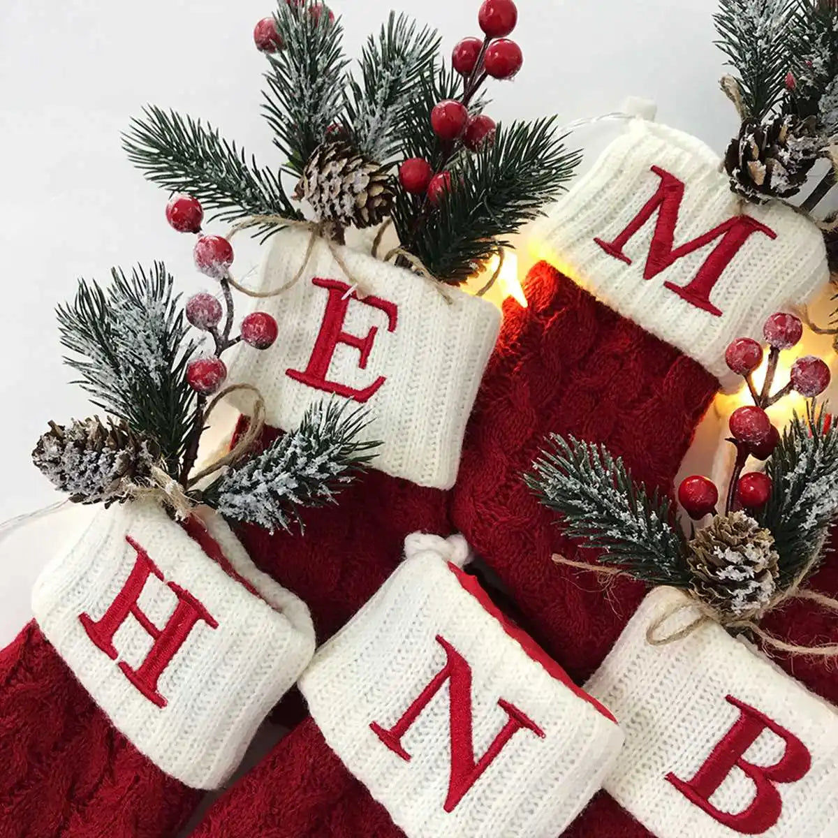 Red cable-knit Christmas stocking with initial cuff