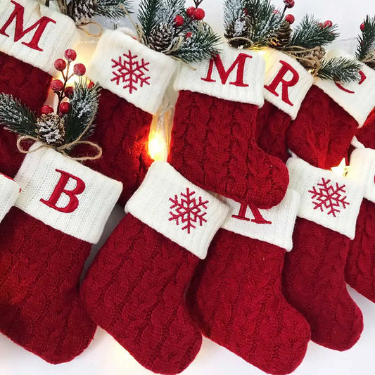 Personalised initial red knit Christmas stockings hanging